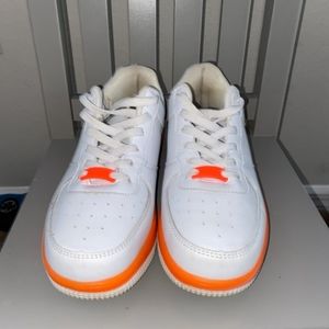 White and neon orange sneakers